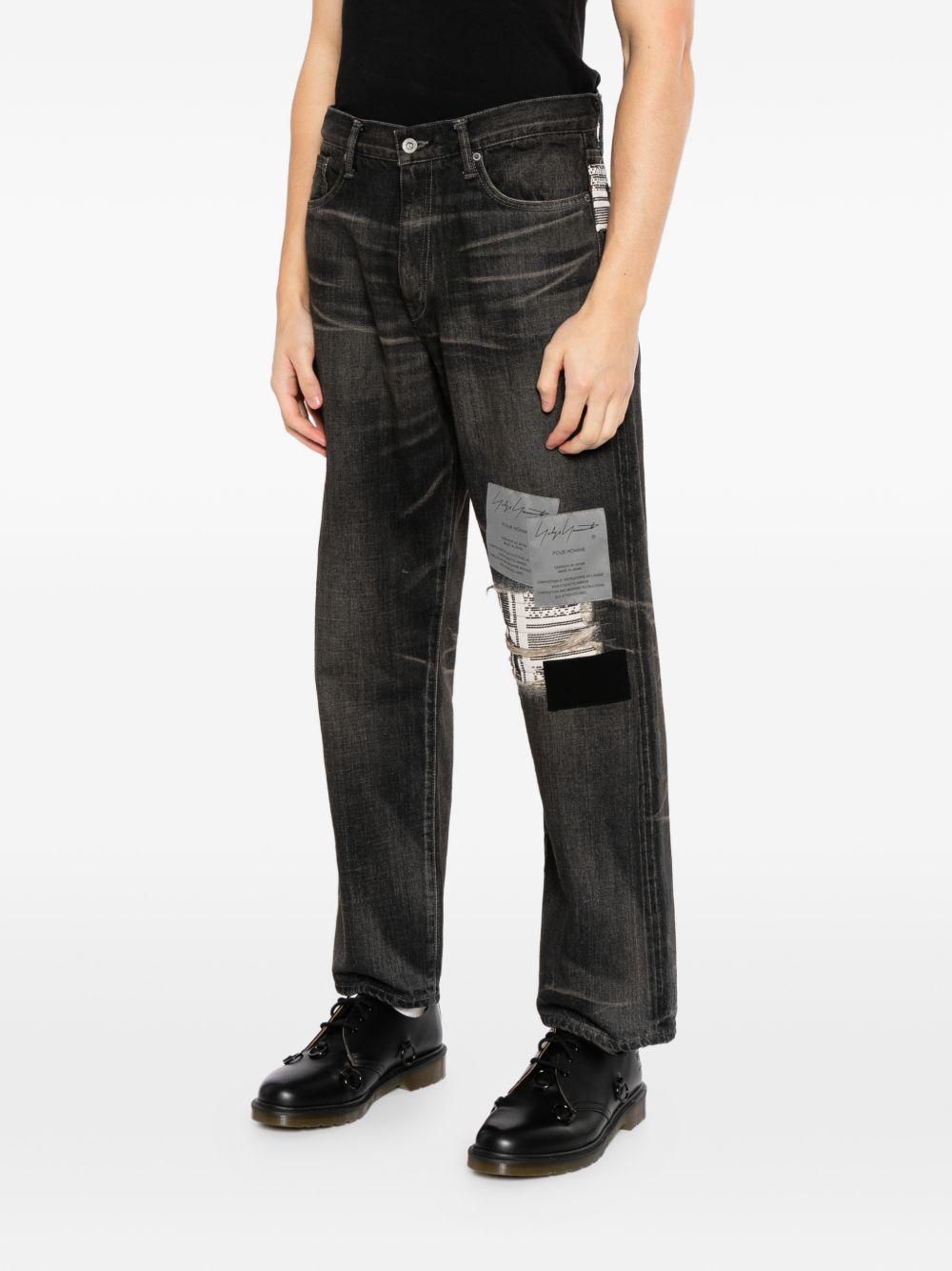 Jeans con patch savage in nero Yohji yamamoto - uomo<BR/> 