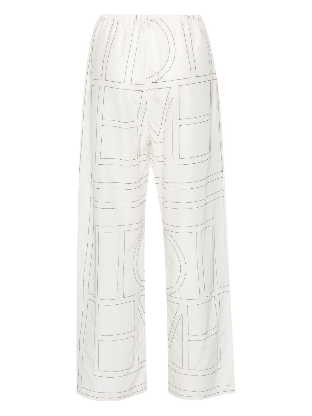 Pantaloni con monogramma ricamato in bianco Toteme - donna 