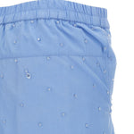 Pantaloni con applicazioni di cristalli in blu 