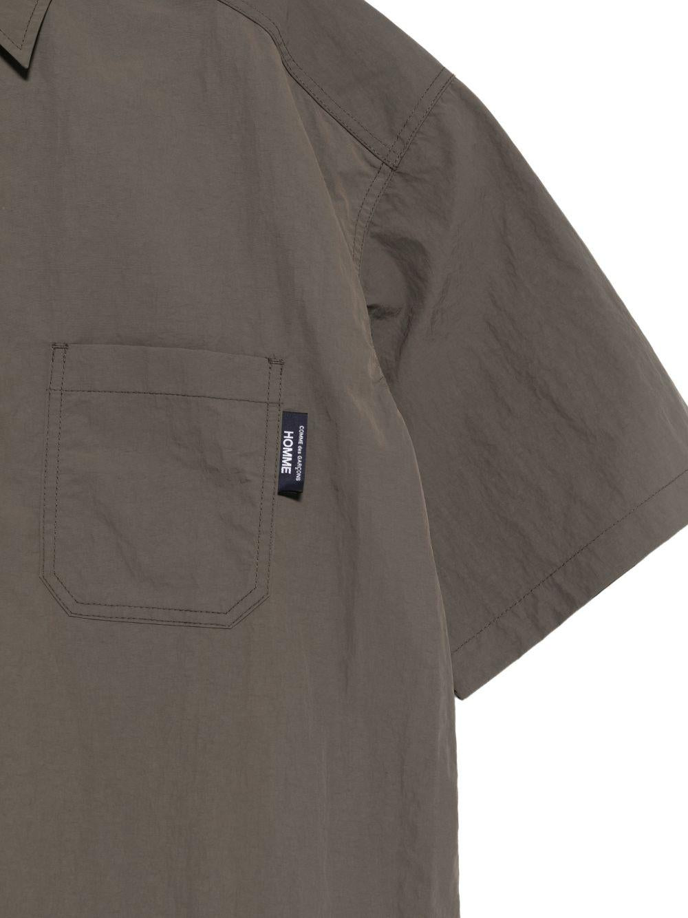 Camicia a maniche corte con patch logo in verde Comme des garcons homme - uomo 