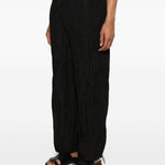 pantaloni plissettati in nero gongdid design - uomo 