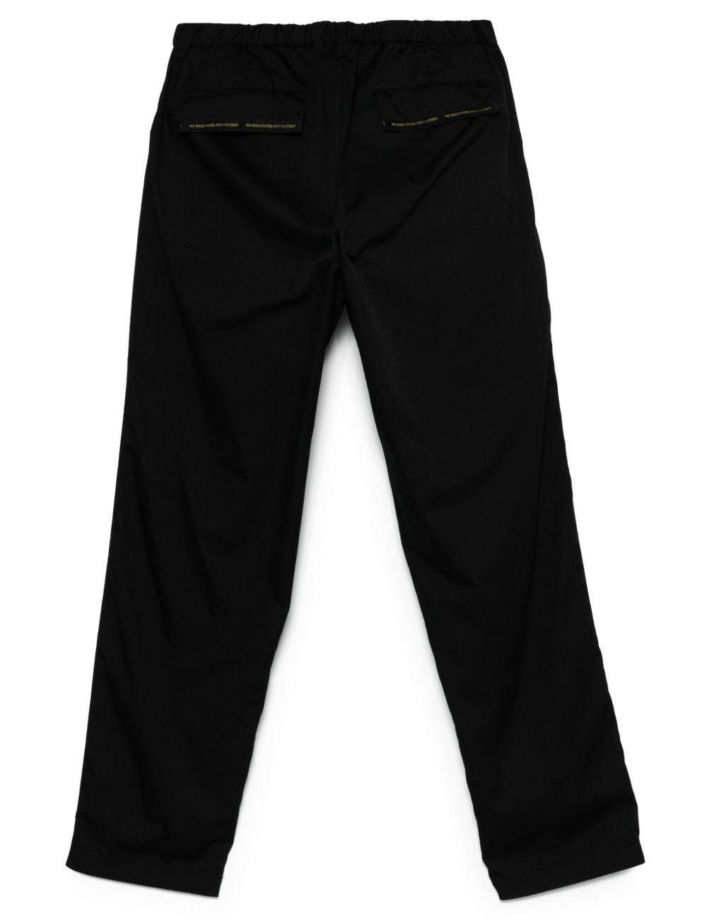 Pantaloni con banda logo in nero Undercover - uomo 