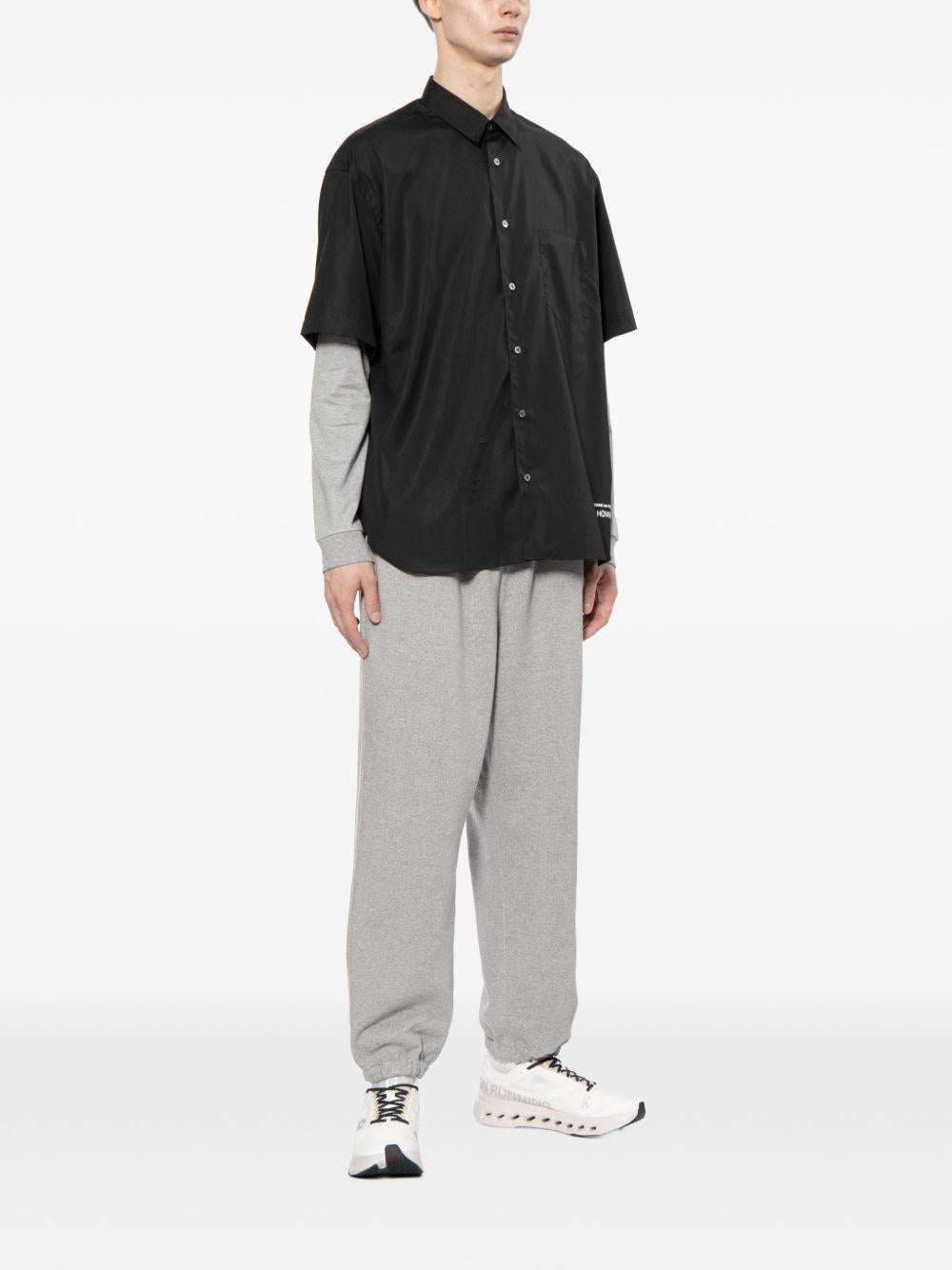 Camicia con logo ricamato in nero COMME DES GARCONS HOMME - uomo 