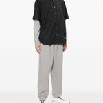Camicia con logo ricamato in nero COMME DES GARCONS HOMME - uomo 