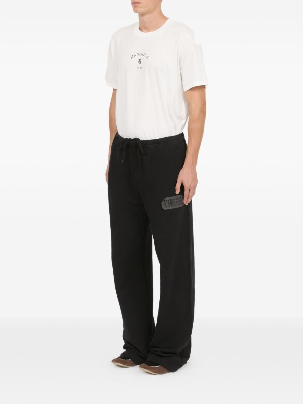 Pantaloni con applicazione in nero Mm6 maison margiela - uomo 