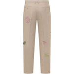Pantaloni con dettaglio fiori in beige KidSuper - uomo 