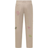 Pantaloni con dettaglio fiori in beige KidSuper - uomo 