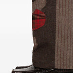Pantaloni a righe con design patchwork  in marrone Kidsuper - uomo 