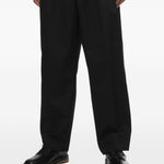 Pantaloni gessati con pieghe in nero Comme des garcons homme - uomo 