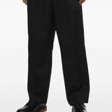 Pantaloni gessati con pieghe in nero Comme des garcons homme - uomo 