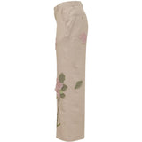 Pantaloni con dettaglio fiori in beige KidSuper - uomo 
