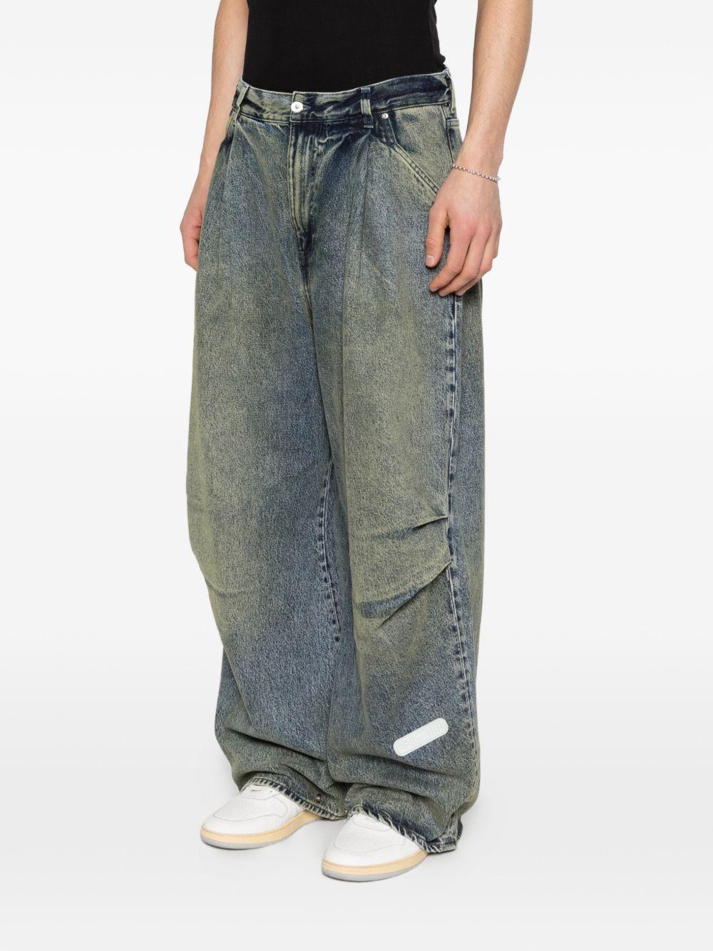 Jeans con pieghe in blu Pdf - uomo 