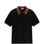 Polo con colletto a contrasto in nero e marrone 
