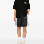 Pantaloncini con coulisse a quadri in nero Amiri - uomo 