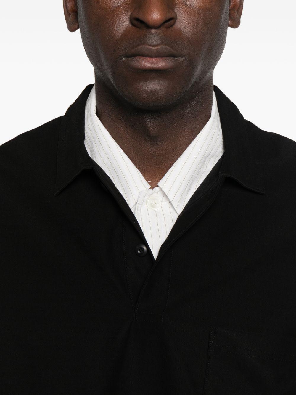 Polo con orlo elasticizzato in nero Comme des garcons homme - uomo 