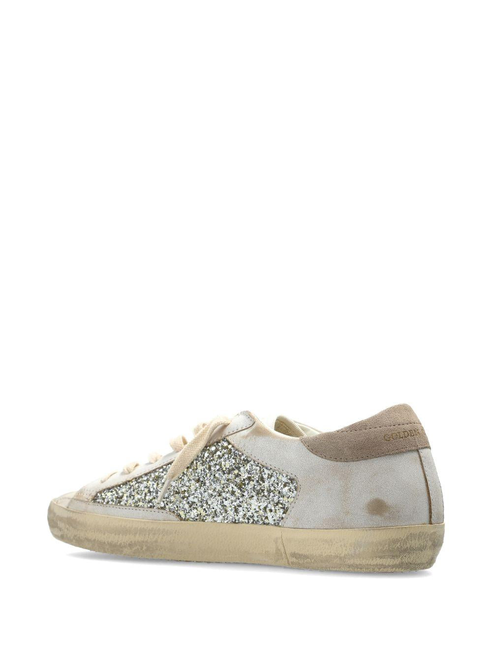 Sneakers super star glitter in avorio e argento golden goose - donna 