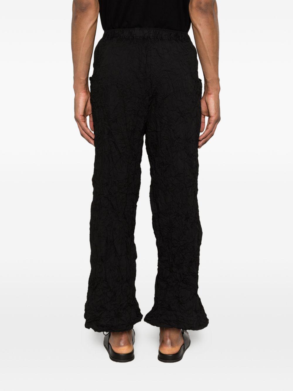 Pantaloni a gamba ampia in nero Gongdid design - uomo 