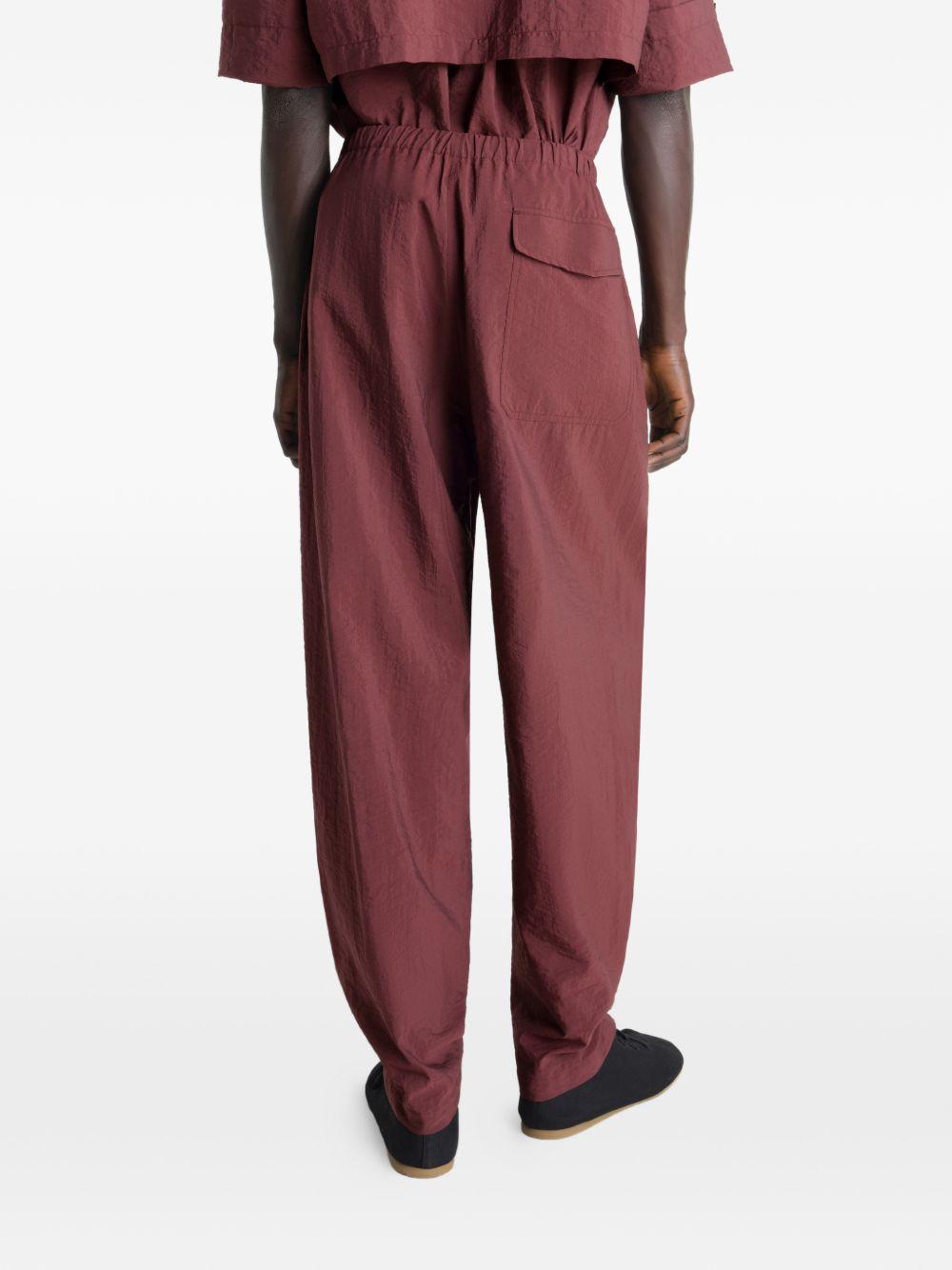 Pantaloni con pieghe in rosso Lemaire - uomo 
