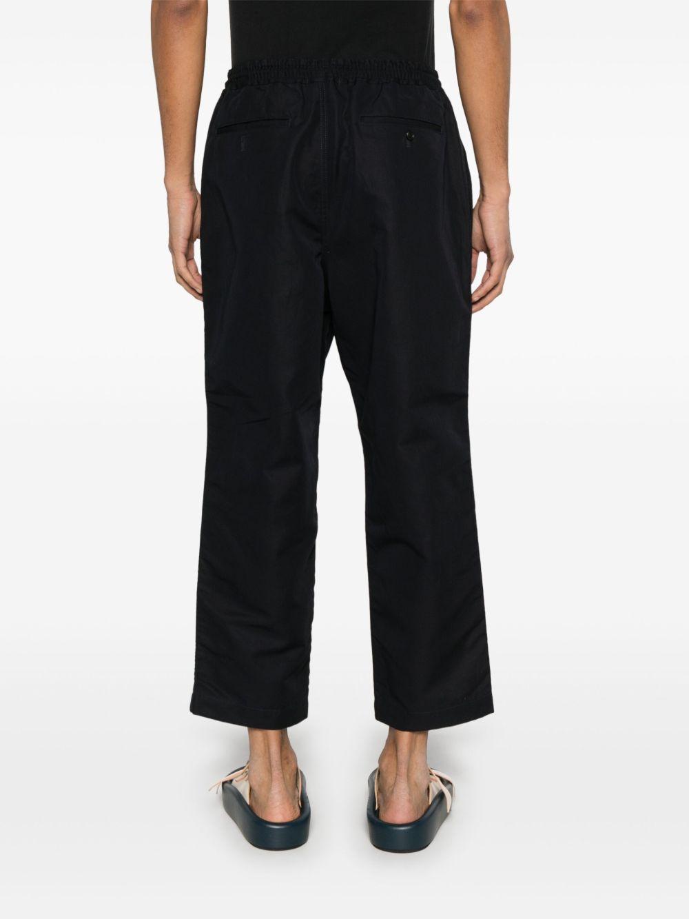 Pantaloni affusolati in blu Comme des Garçons Homme - unisex 