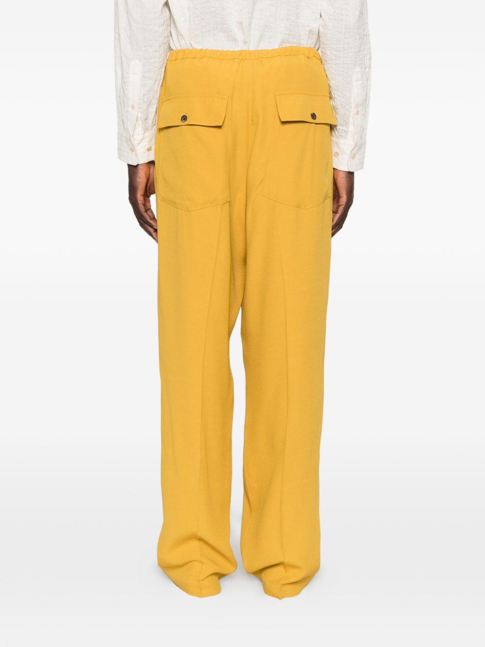 Pantaloni con coulisse in vita e piega stirata in giallo Second layer - uomo 