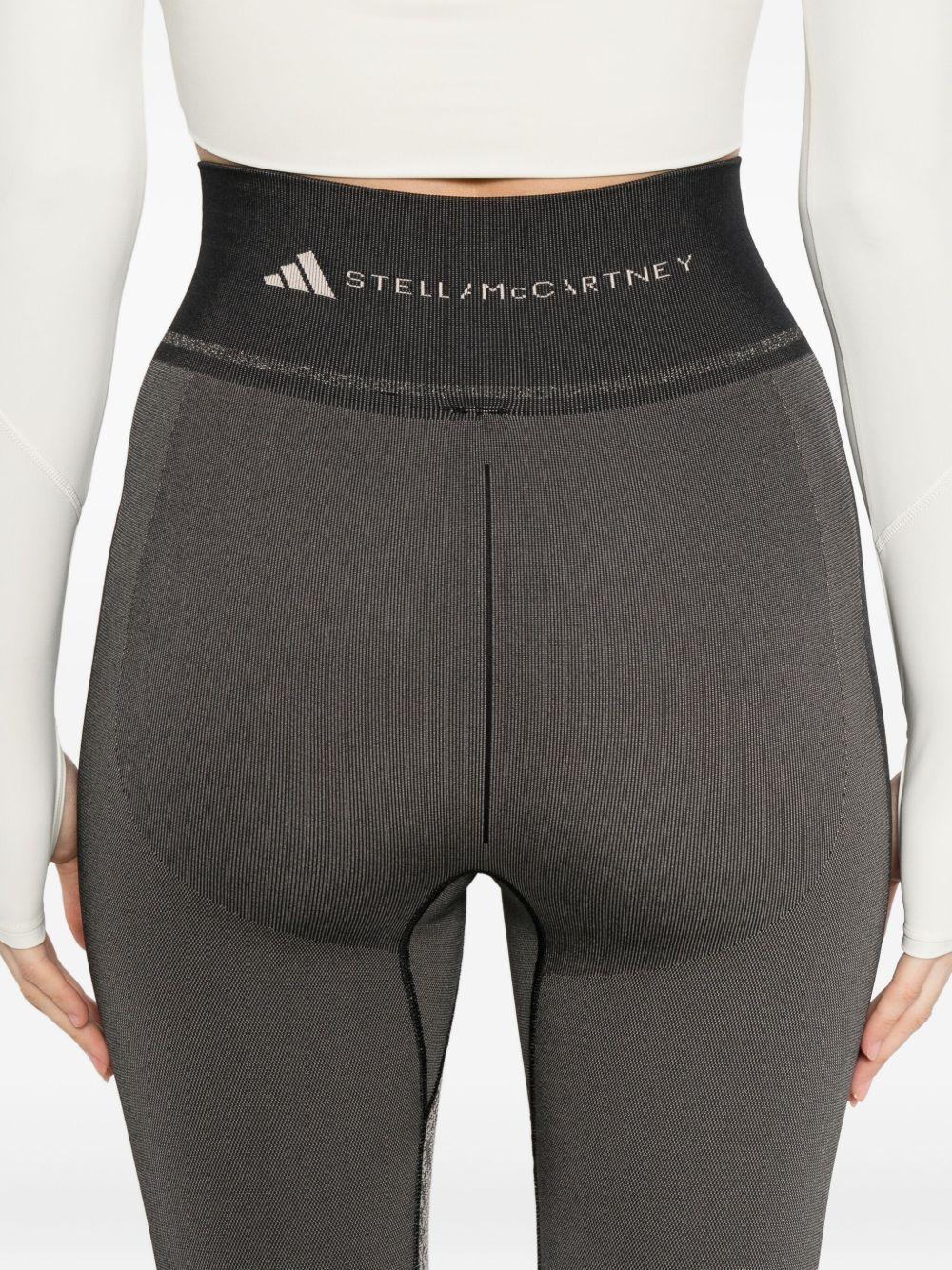 Leggingsi con stampa serpente in nero Adidas by stella mc cartney - donna 