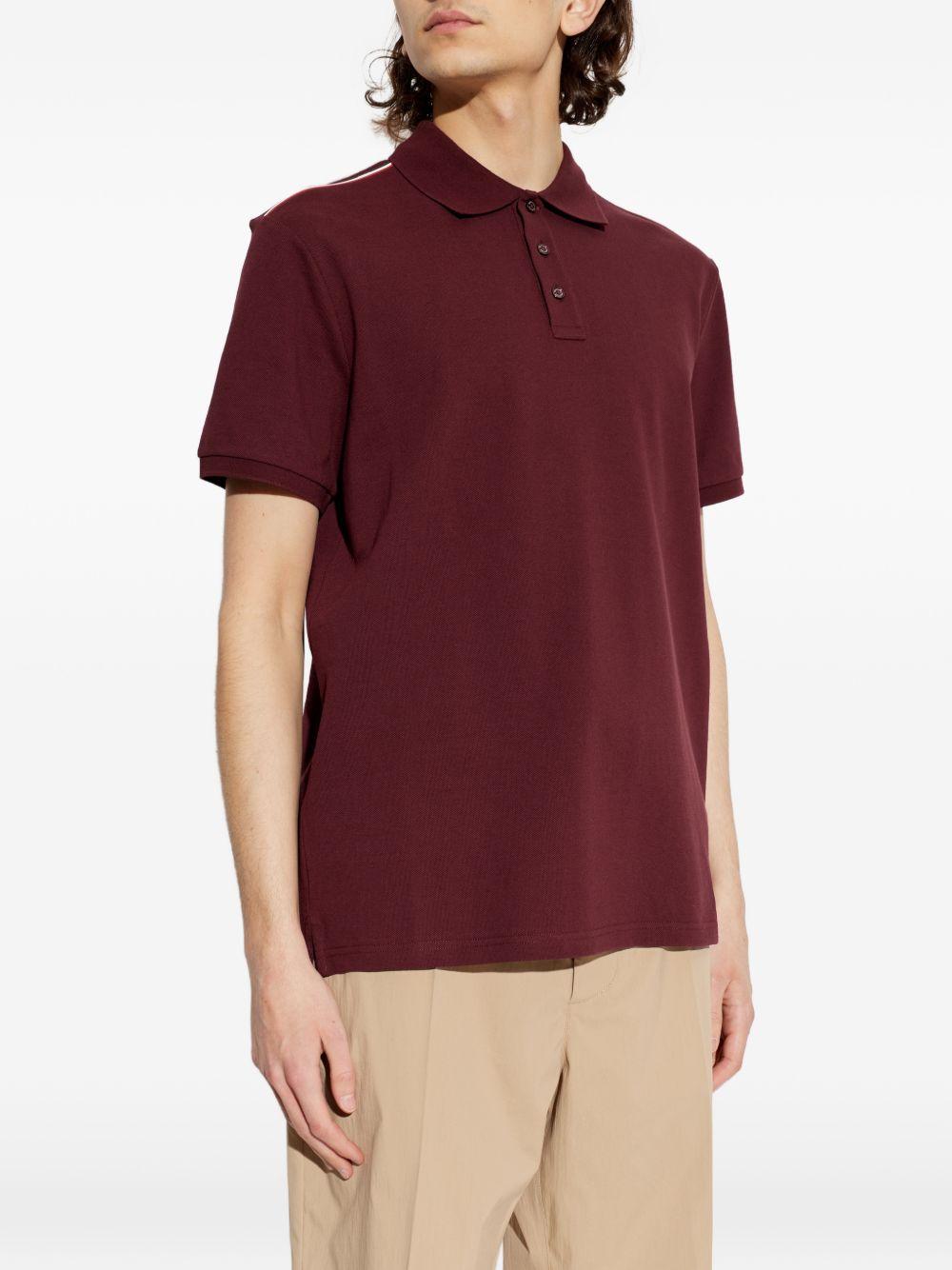 Polo con dettaglio a righe in piquet in rosso Moncler - uomo 