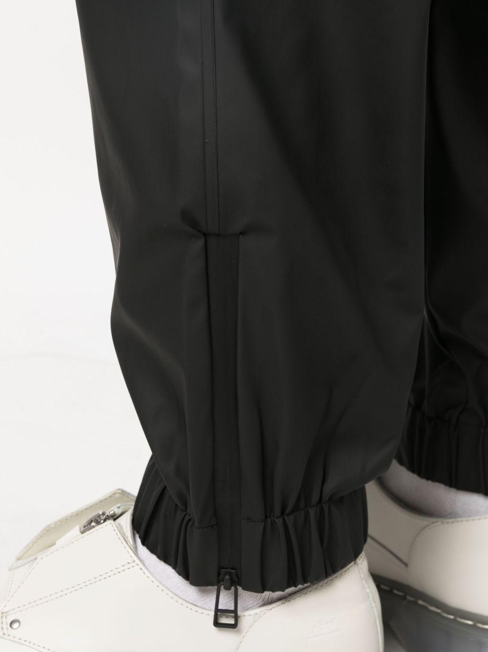 Pantaloni elasticizzati con coulisse in nero Rains - donna 