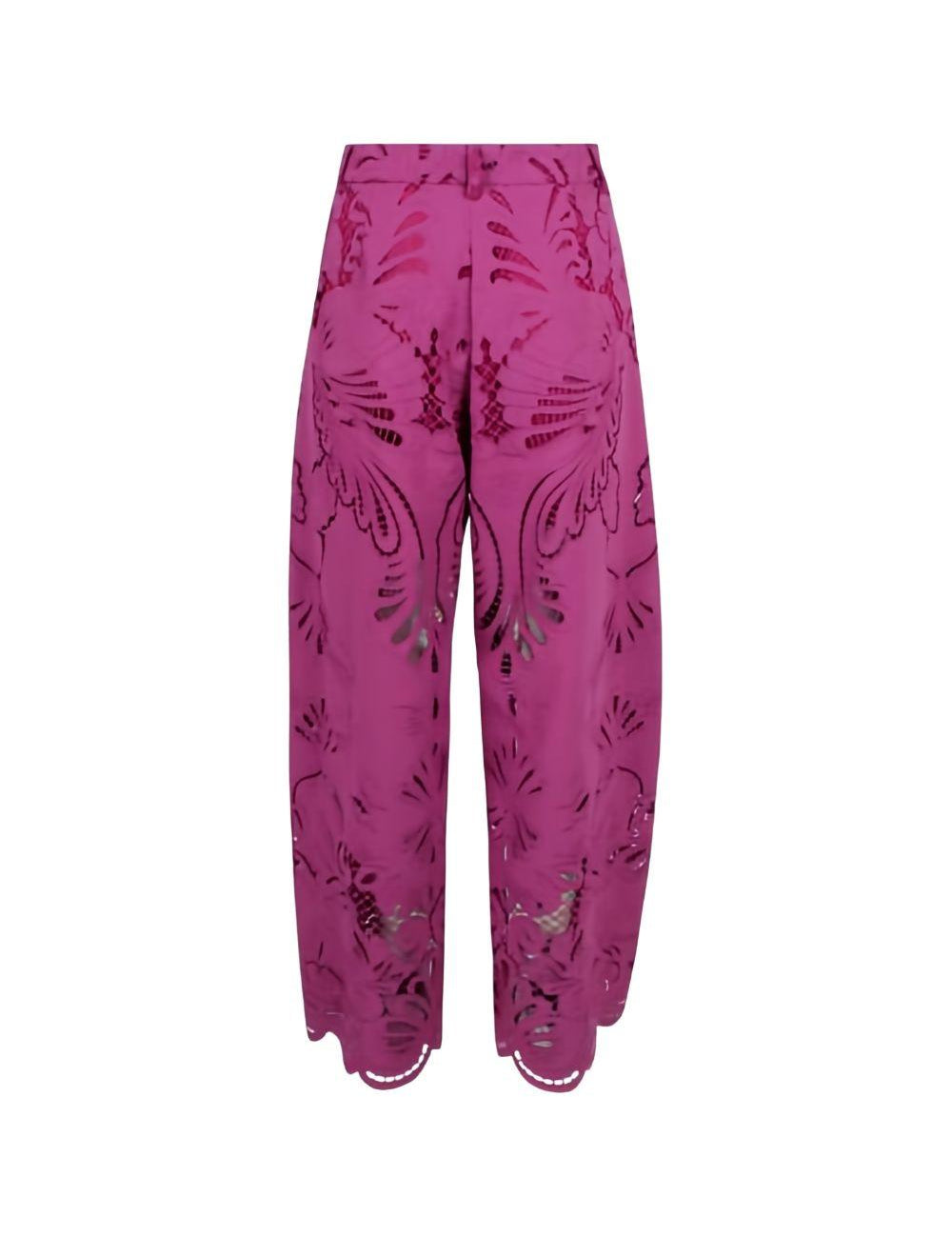 Pantaloni palazzo con dettagli floreali in rosa 