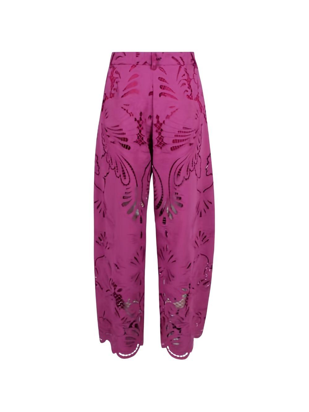 Pantaloni palazzo con dettagli floreali in rosa 