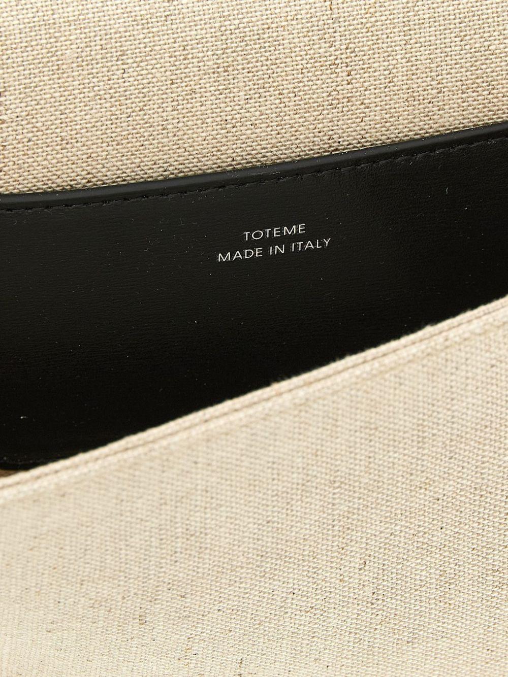Clutch in tela con falda a T in beige 