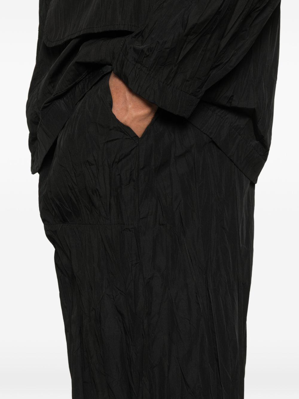 pantaloni plissettati in nero gongdid design - uomo 