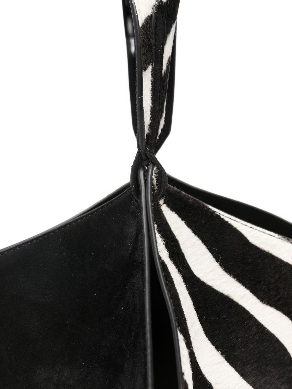 Borsa a mano Lotus con stampa zebrata in nero e bianco Khaite - donna 