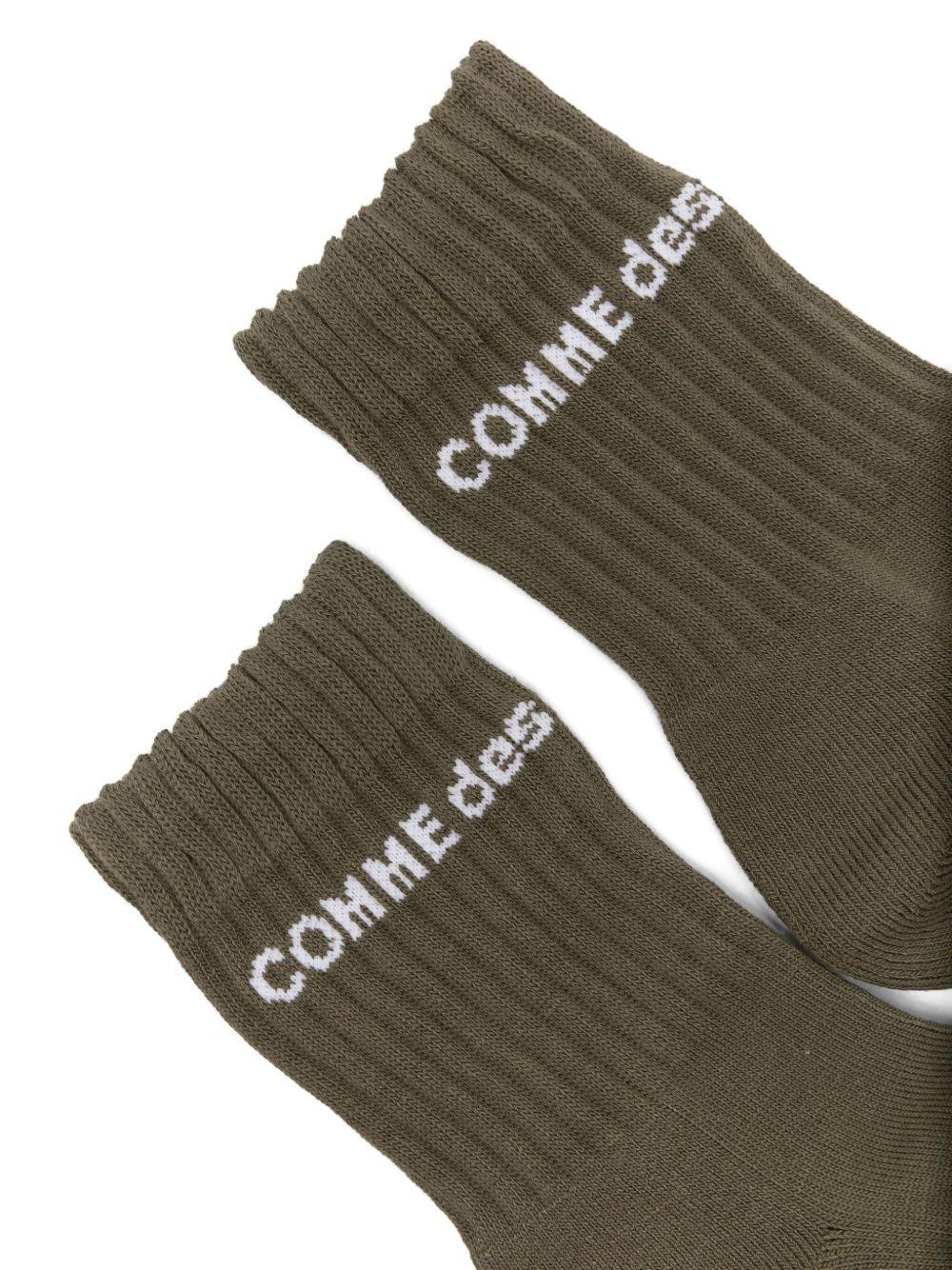 Calzini con logo in verde Comme des garcons homme plus - uomo<BR/><BR/> 