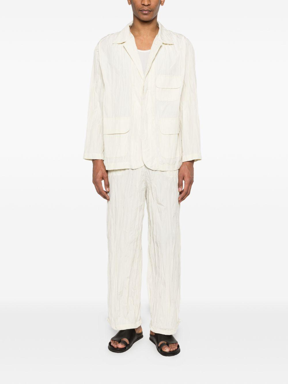pantaloni plissettati in bianco gongdid design - uomo 