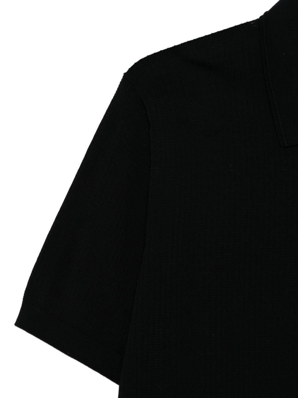 Polo a coste con zip in nero Kangra - uomo 