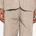 Pantaloni con vita elasticizzata in beige Gongdid design - uomo 