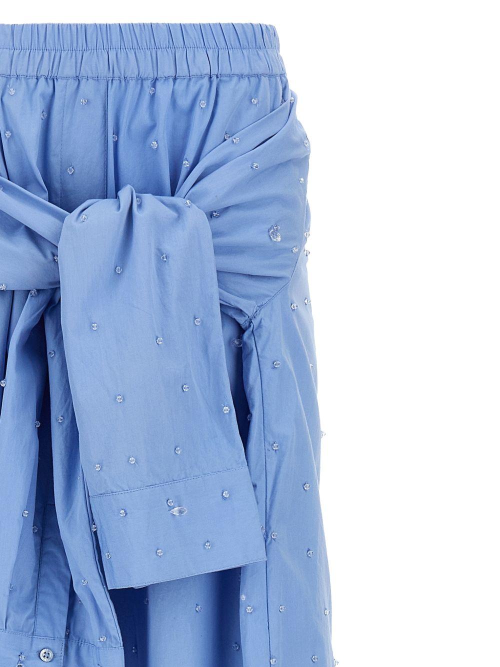 Pantaloni con applicazioni di cristalli in blu 