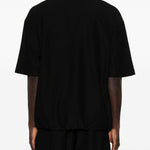 Polo con orlo elasticizzato in nero Comme des garcons homme - uomo 