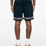 Shorts in twill con ricami floreali in blu Found - uomo 