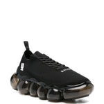 Sneakers con suola a bolle in nero Undercover - uomo 