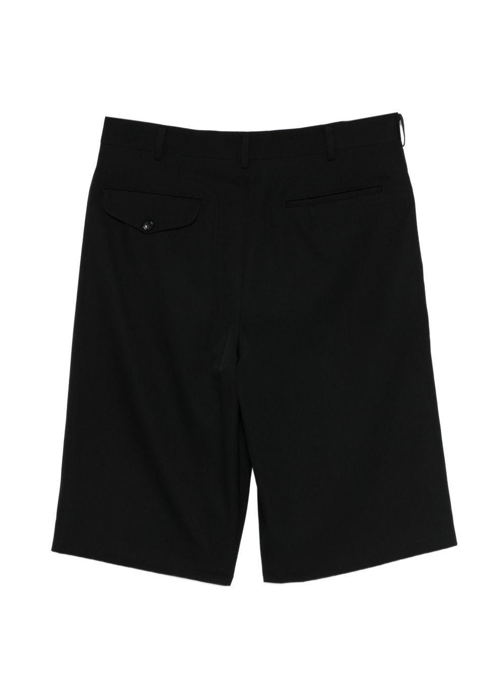 Pantaloni corti con bottoni in nero Comme des Garçons Homme Plus - uomo 