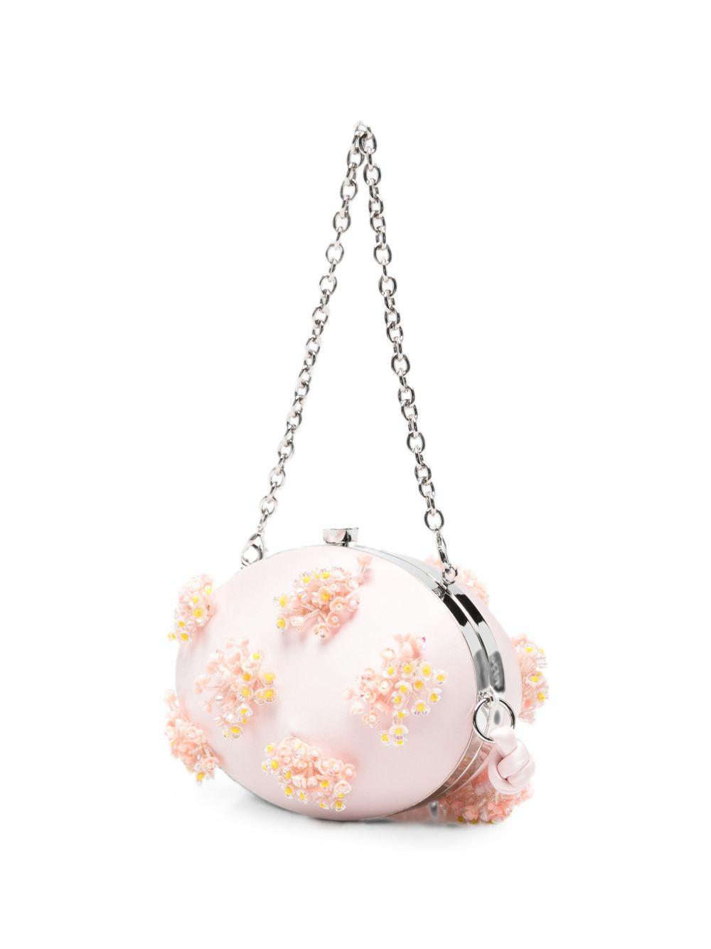 Clutch in raso rosa con decorazioni floreali 