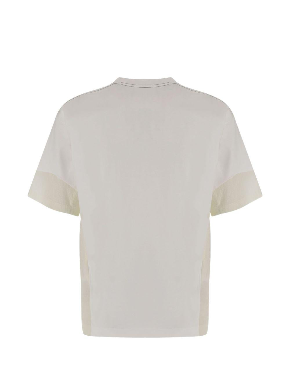 T-shirt a maniche corte con tasca in bianco And wander - uomo 