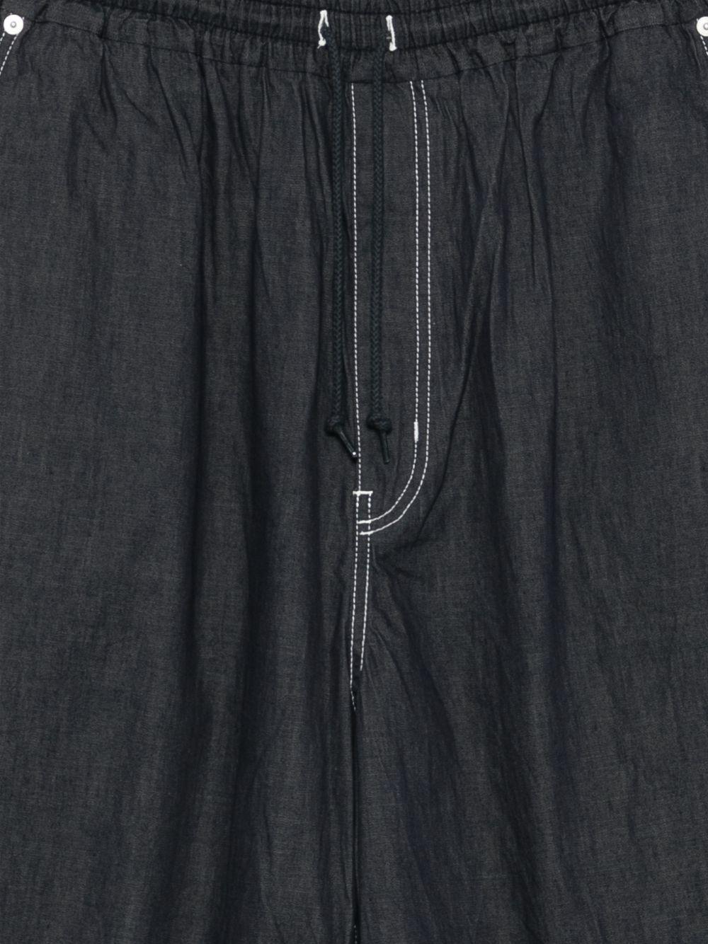Pantaloncini con cuciture a contrasto in blu Comme des garcons homme - uomo 