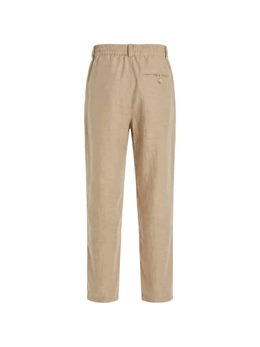 Pantaloni Croisière a pieghe con elastico in vita in beige Jacquemus - uomo 