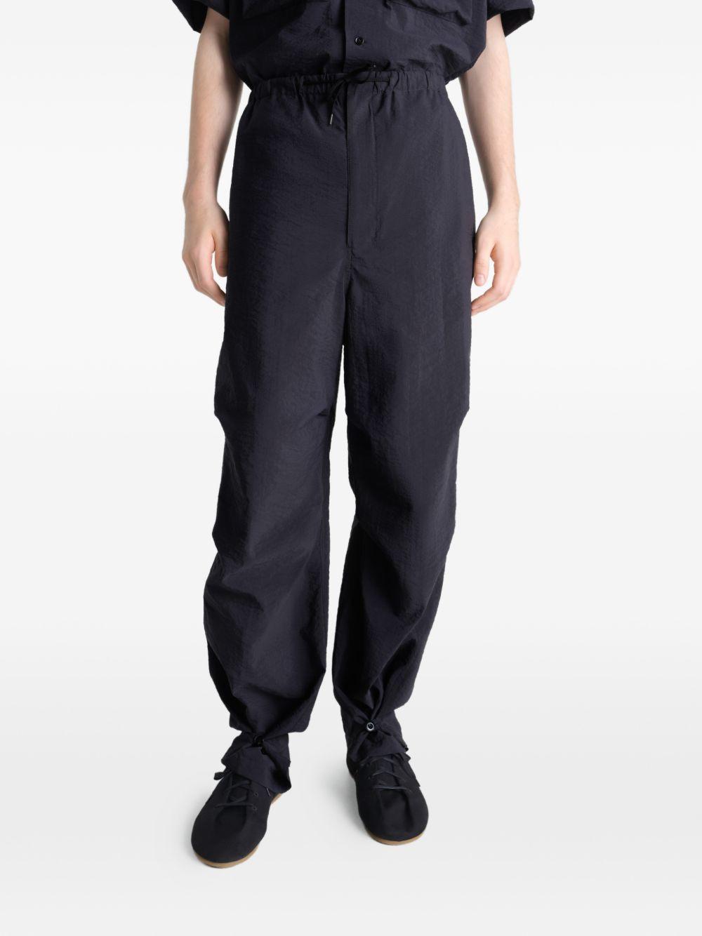 Pantaloni con tasche in nero LEMAIRE - uomo 