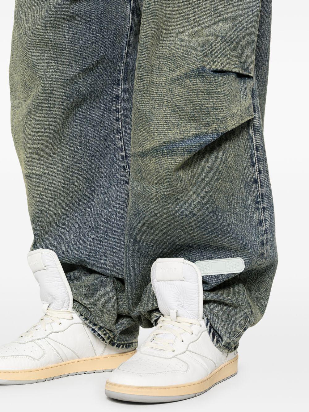 Jeans con pieghe in blu Pdf - uomo 