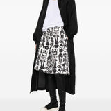 Shorts con stampa Fantasia in nero e bianco Comme des garcons black - unisex 