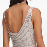 Miniabito decorato con strass in beige 