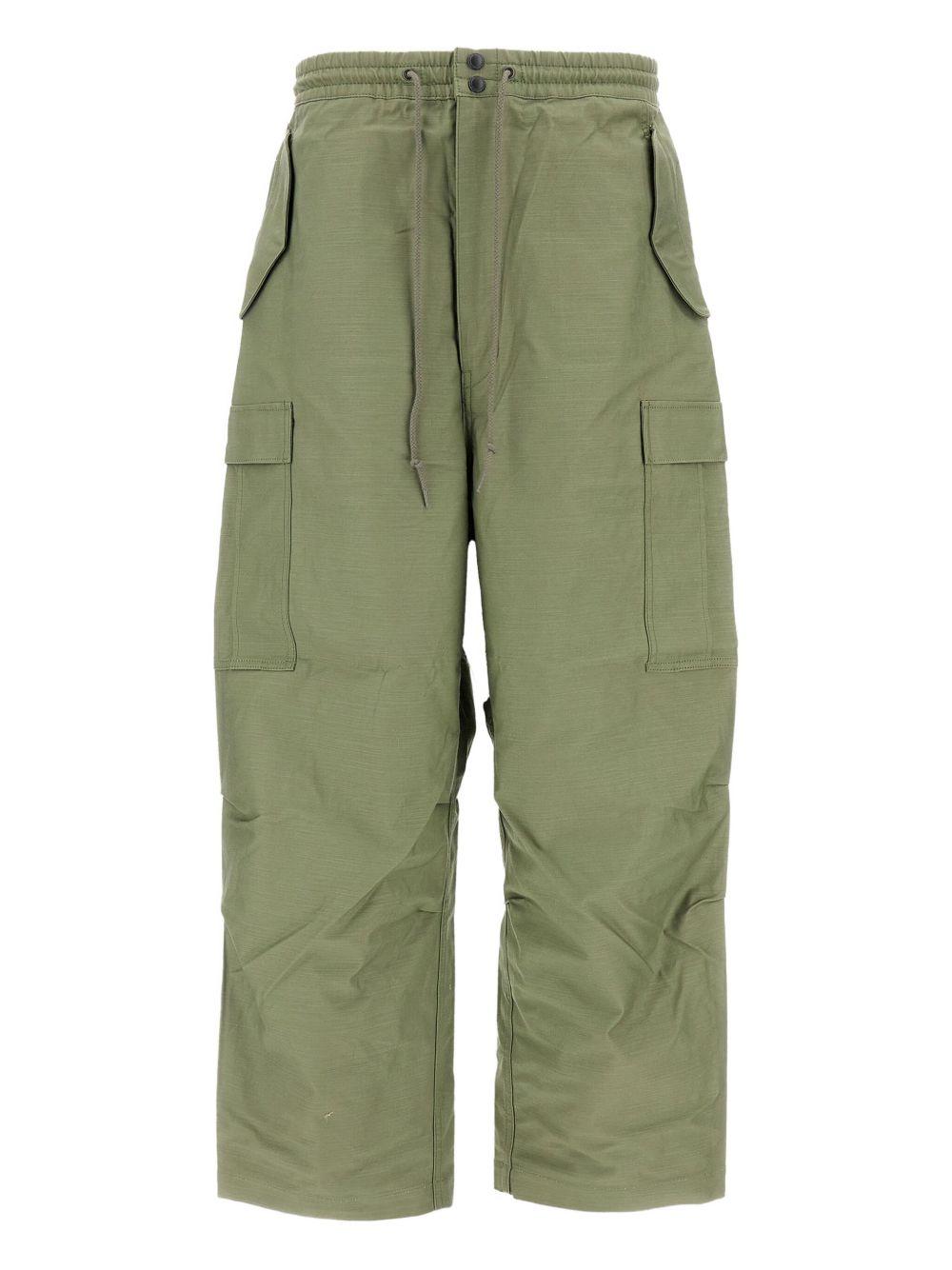 Pantaloni con tasche cargo in verde Junya watanabe - uomo 